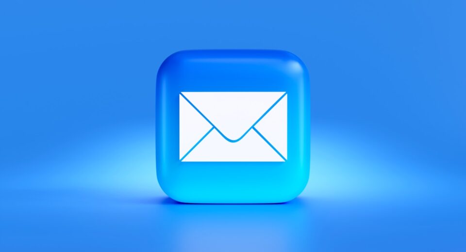 a blue button with a white envelope on it